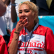 Miki Sudo scarfs down a hot dog, as one does in a hot-dog eating competition.
